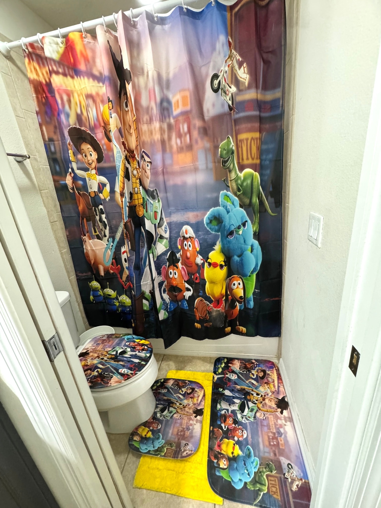 Toy Story themed bathroom with character shower curtain and matching decor